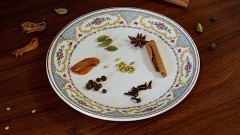 Ganze Gewürze für das Lebkuchengewürz auf einem Teller - Whole spices for a German gingerbread spice mix on a plate