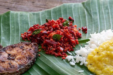 Beetroot Thoran on a banana leaf with fish, yellow dal and rice