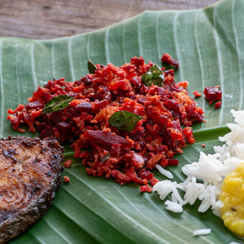 Beetroot Thoran on a banana leaf with fish, yellow dal and rice